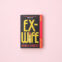 Ex-Wife paperback on a light pink background