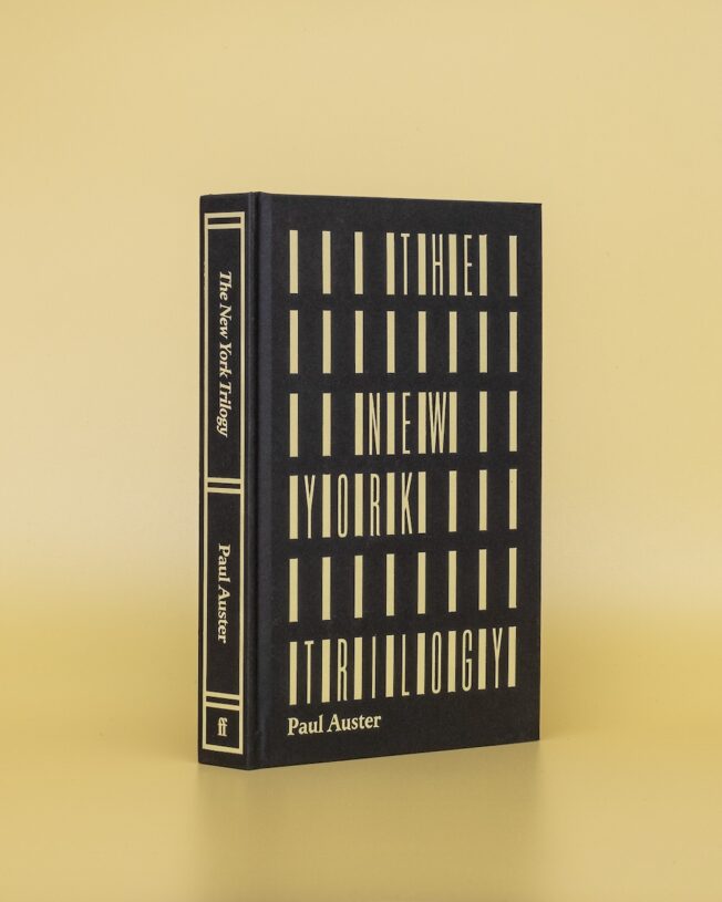 Faber Members Edition of Paul Auster's New York Trilogy on a pale yellow background