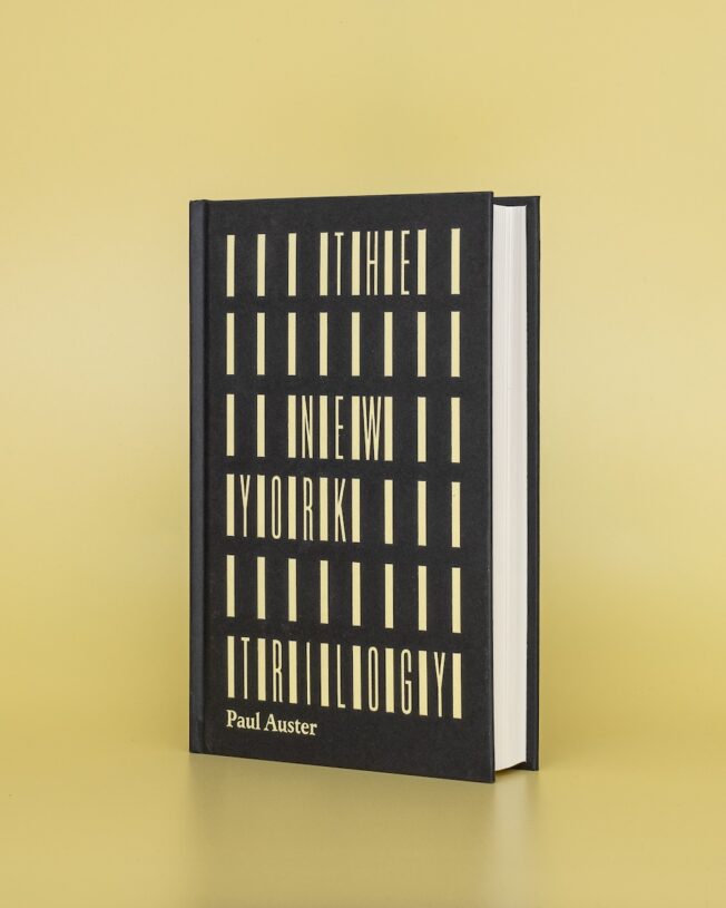 Faber Members Edition of Paul Auster's New York Trilogy on a pale yellow background