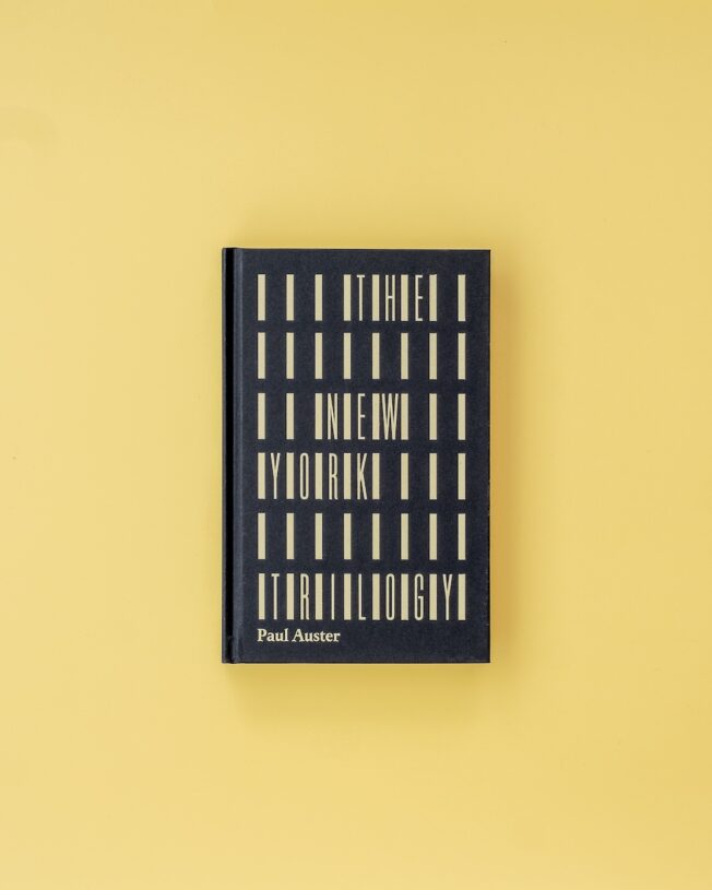 Faber Members Edition of Paul Auster's New York Trilogy on a pale yellow background